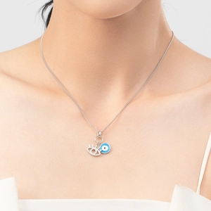 S925 sterling silver evil eye necklace with blue pendant on a female model