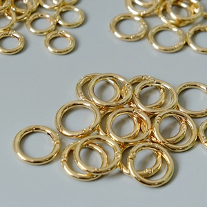 Close-up of golden metal spring O-rings for DIY jewelry and bag hardware accessories