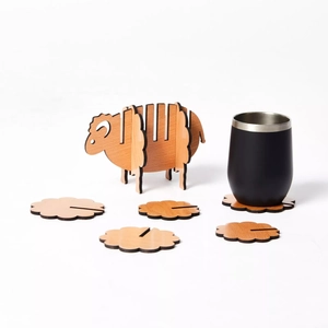 Detail of wooden sheep coaster set with flower-shaped heat mats and storage stand