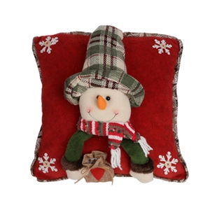 Detail of red Christmas pillow featuring 3D snowman with green plaid hat and white snowflakes
