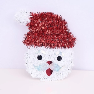 Santa Claus Christmas tree ornament with red sequins and white glittery beard on white background
