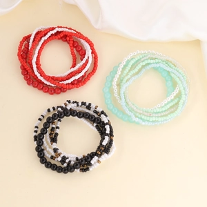 Bohemian seed bead bracelet set in red, green, and black with multi-layer elastic design