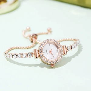 Elegant rose gold women's bracelet watch featuring sparkling rhinestones and quartz dial