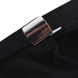 Close-up of black cotton baseball cap with adjustable silver metal buckle and strap