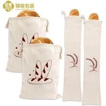 Detail of cream canvas storage bags with drawstring closure and wheat pattern prints
