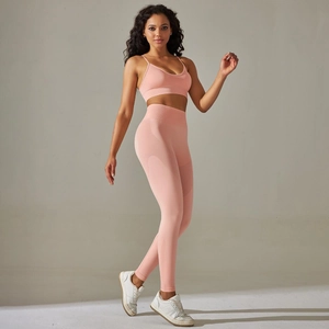 Detail of pink seamless knit yoga set with breathable mesh texture and cross back sports bra
