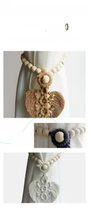 Detail of hand-woven cotton curtain tiebacks with wooden beads and leaf-shaped tassels