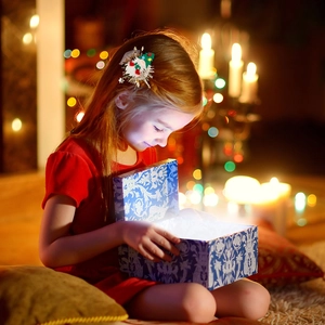 Christmas hair clips for girls featuring Santa Claus and tree patterns in festive setting