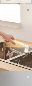 Detail showing the ergonomic tilted handle and stiff bristles of the gap cleaning brush