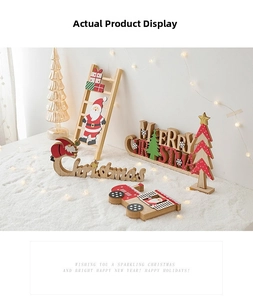 Detailed view of wooden Christmas ornaments with painted Santa and festive letters