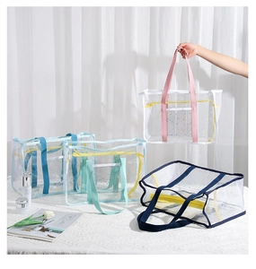 Transparente Netztaschen in verschiedenen Farben mit gelbem Reißverschluss und Griffen