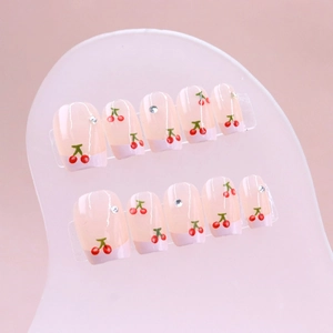 Pink cherry press-on nails with silver rhinestones in a short square shape