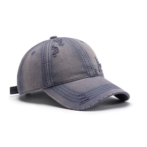 Distressed washed denim baseball cap with frayed holes in vintage blue and purple