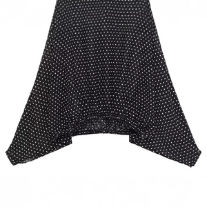 Elegant black and white polka dot shirt featuring premium pleated details and bow accents