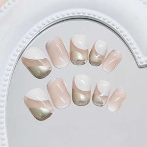 Minimalist oatmeal nude and white press-on nails with silver glitter accents and metallic finish