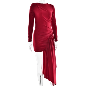 Detailed view of red bodycon dress with side ruching and asymmetrical cascading ribbon