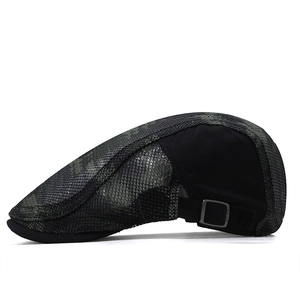 Detail view of the breathable camo mesh fabric and adjustable metal buckle on the cap