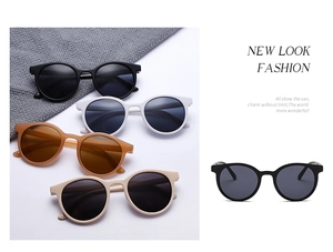 Detail showing vintage round sunglasses in black, white, amber, and beige frame options