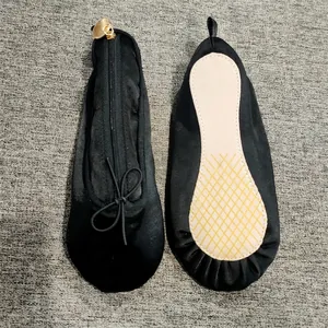 Detailed view of satin ballet slipper case with zip closure and anti-slip sole texture