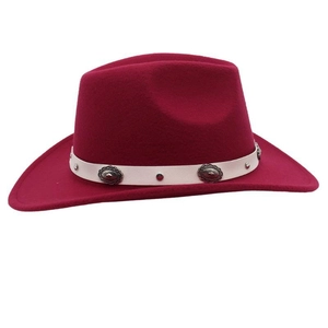 Close-up of wine red fedora hat with white leather band and vintage silver metal studs