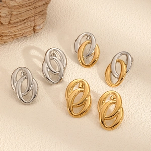 Detail of interlocking oval double hoop earrings in gold and silver stainless steel finish