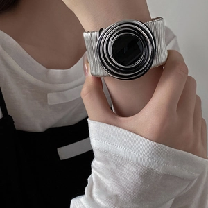 Punk multilayer silver metal wire wrap bangle with bold black circular resin centerpiece