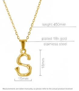 Detail view of 18k gold plated stainless steel S letter pendant with bamboo texture