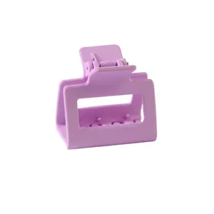 Detail view of the lavender matte rectangular hair claw clip with interlocking teeth