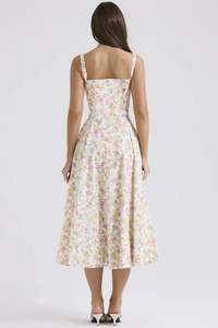 Detail view of the back of a French floral midi dress with tie straps and backless design