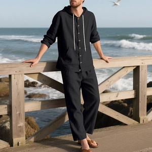 Detail of men's linen hooded shirt and pants set with button closure for beach leisure
