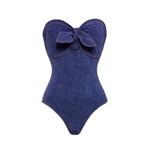 Detail of ruffle denim print swimsuit featuring a strapless bow and contrast stitching