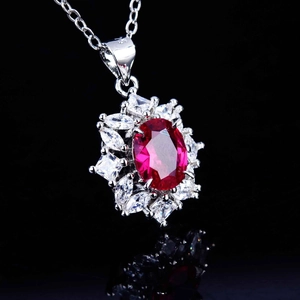 Luxury S925 silver necklace with an oval red gemstone pendant and white zircon accents