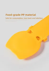 Detail of bright yellow pet feeder spoon made from safe food-grade PP material