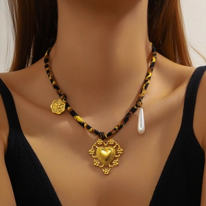Leopard print cotton cord necklace with golden heart pendant and pearl detail