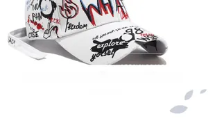 Close-up of white cotton baseball cap with red and black graffiti and Freedom lettering