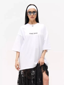 Close-up of the black 'Only Jesus' printed lettering on a white heavy cotton oversize T-shirt
