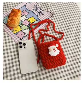 Detailed knit of red reindeer-themed crochet bag with Santa Claus for toddlers