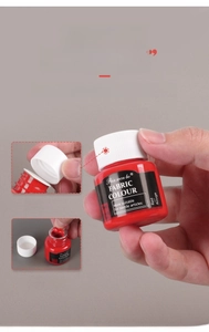 Detailed view of 25ml red fabric paint bottle with secure screw cap and aluminum seal
