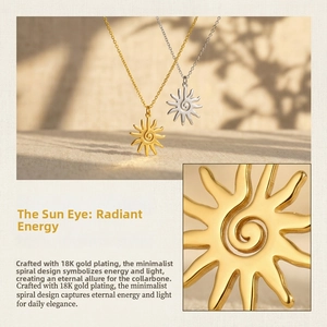 Macro detail of 18K gold and silver plated spiral sun pendants on minimalist chains