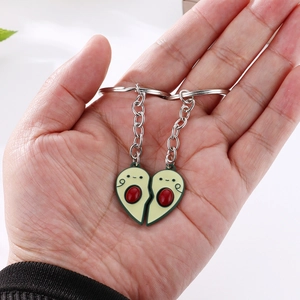 Detailed view of magnetic heart-shaped avocado couple keychain with enamel finish