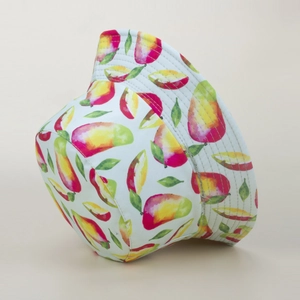 Close-up of summer sun hat with realistic mango fruit prints and stitched brim detail