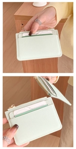 Detail of light green striped large capacity card holder with gold zipper and card slots