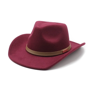 Detail of the deep burgundy wool felt cowboy hat with brown leather belt and metal buckle