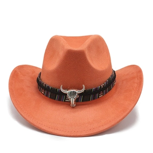 Detail of orange suede cowboy hat with ethnic woven band and silver bull skull ornament