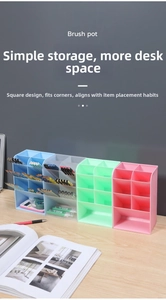 Detailed close-up of colorful four-grid plastic pencil holders on a wooden desk
