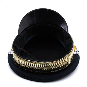 Detail of black captain hat with gold metal chains, colorful rhinestones and sequins
