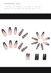 Detail of long ballet press-on nails featuring leopard print, rhinestones and french tips
