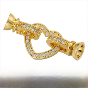 Detailed view of heart-shaped gold brass clasp with zircon pave for DIY necklaces