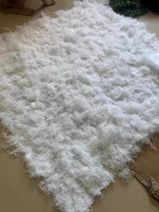 Macro detail of thick white artificial silk moss fibers for landscape decoration