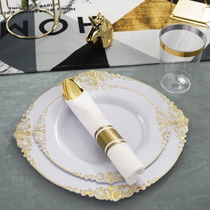Elegant disposable dinnerware set with gold embossed white plates and golden cutlery